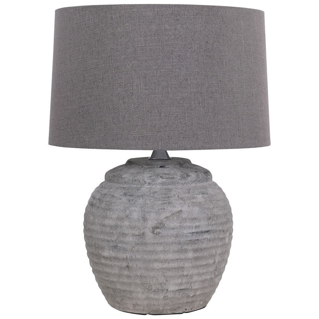 The Rosso Small Stone Table Lamp is crafted with quality and elegance in mind, featuring a stone base and minimalist design