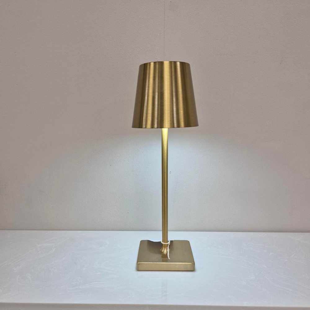 The stylish Rechargeable LED Table Lamp in Gold features 3 light tones, a built in USB port for convenient charging & a compact 33cm design