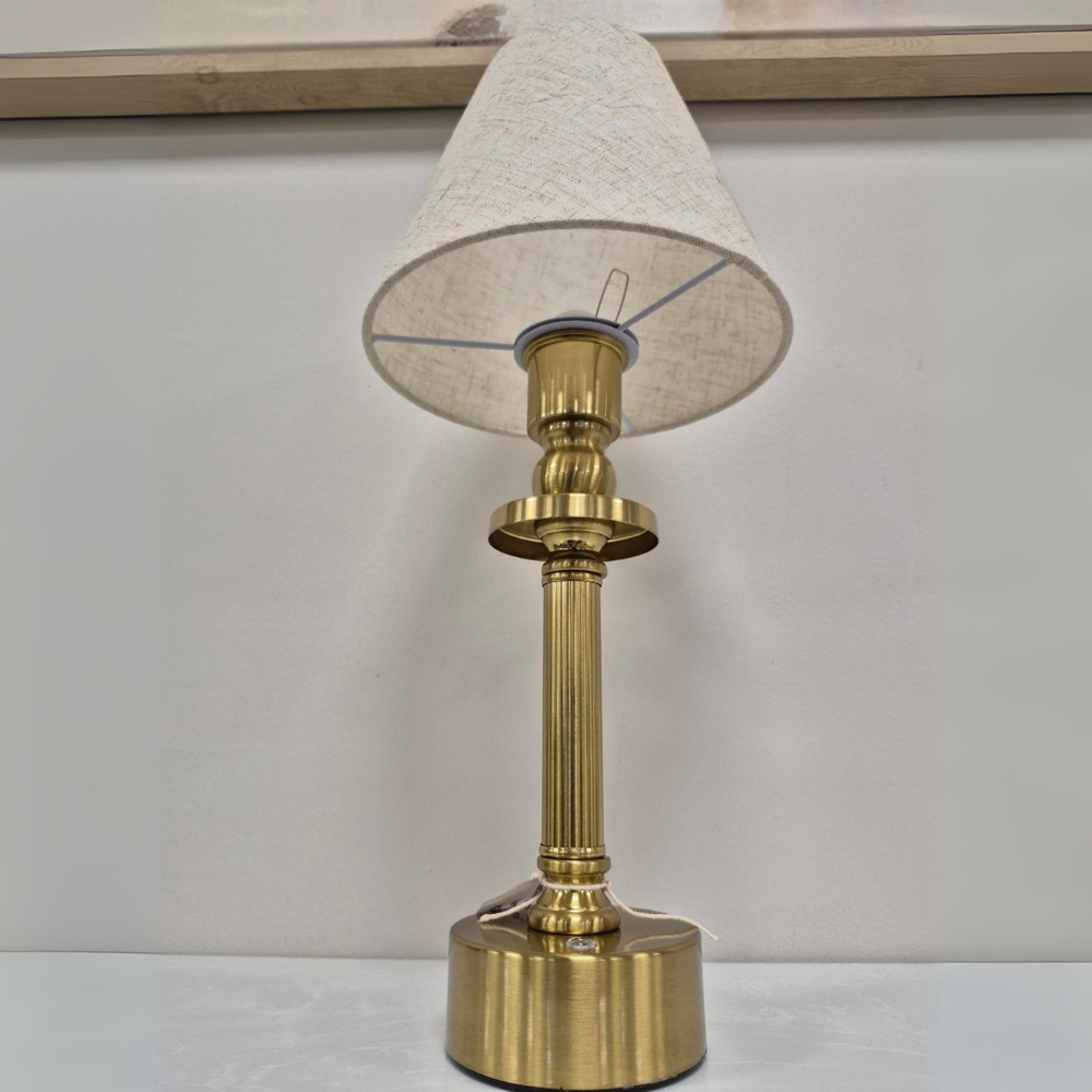The Rechargeable LED Table Lamp 40cm offers RGBW colour, 3 light levels & tactile switch, an Antique Gold base & Linen Shade adding classic charm