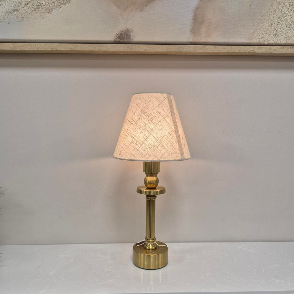 The Rechargeable LED Table Lamp 40cm offers RGBW colour, 3 light levels & tactile switch, an Antique Gold base & Linen Shade adding classic charm