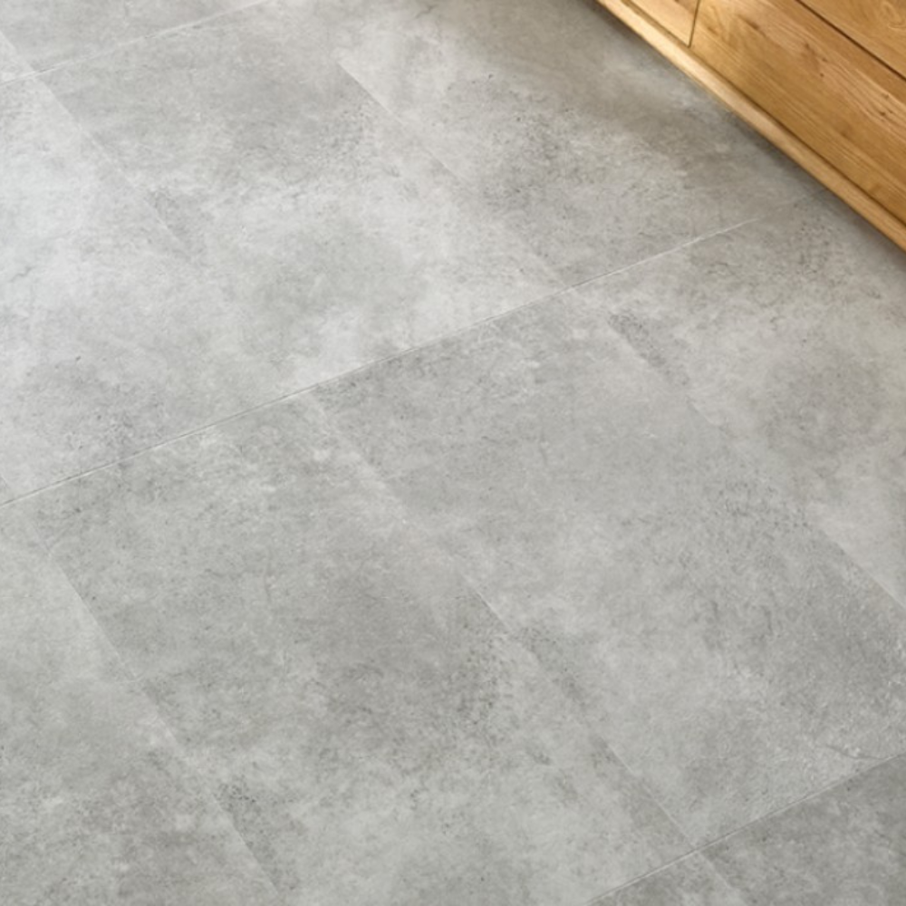 The Ribeira Silver Forma Tile SPC Flooring features sleek tile design, waterproof mineral core, Titanium Nano finish and 25 year warranty