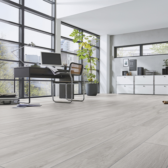 The Robusto Oak Premium Laminate Flooring - 12mm features, AC5 durability, eco-friendly and easy 5G click system installation.