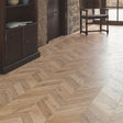 Rochesta Oak Laminate Flooring 8mm in chevron style featuring AC4 durability, easy installation, and a warm rustic oak finish.