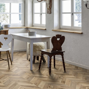 Rochesta Oak Laminate Flooring 8mm in chevron style featuring AC4 durability, easy installation, and a warm rustic oak finish.