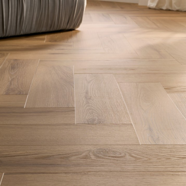 The Rochester Oak Herringbone SPC Flooring features a timeless oak design, suitable for underfloor heating, Titanium Nano finish and a 25 year warranty