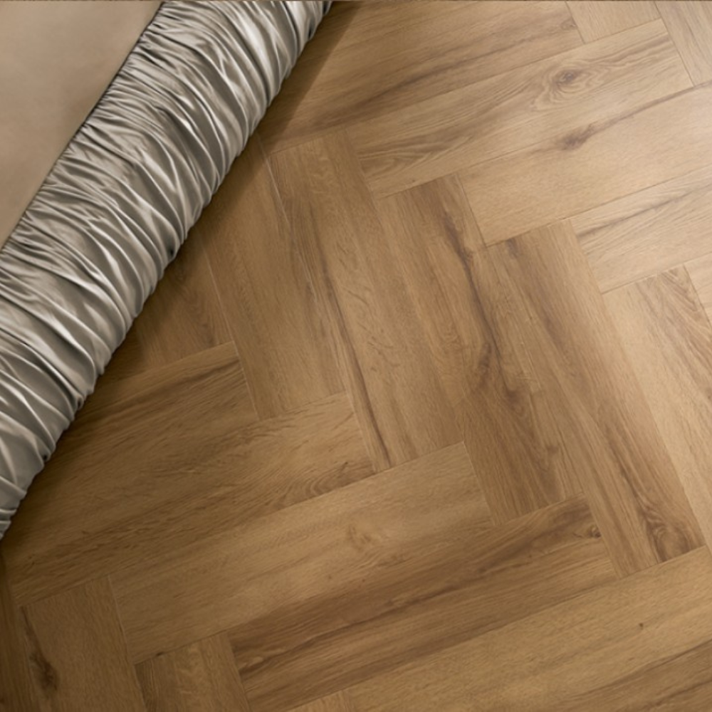 The Rochester Oak Herringbone SPC Flooring features a timeless oak design, suitable for underfloor heating, Titanium Nano finish and a 25 year warranty