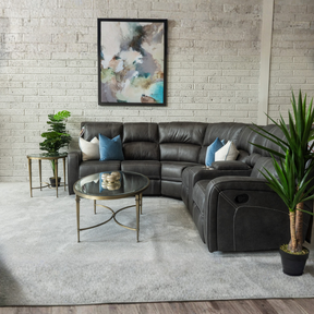 The Rowen Manual Recliner Corner Sofa is upholstered in gunmetal and easy-clean fabric, plush cushions and spacious seating