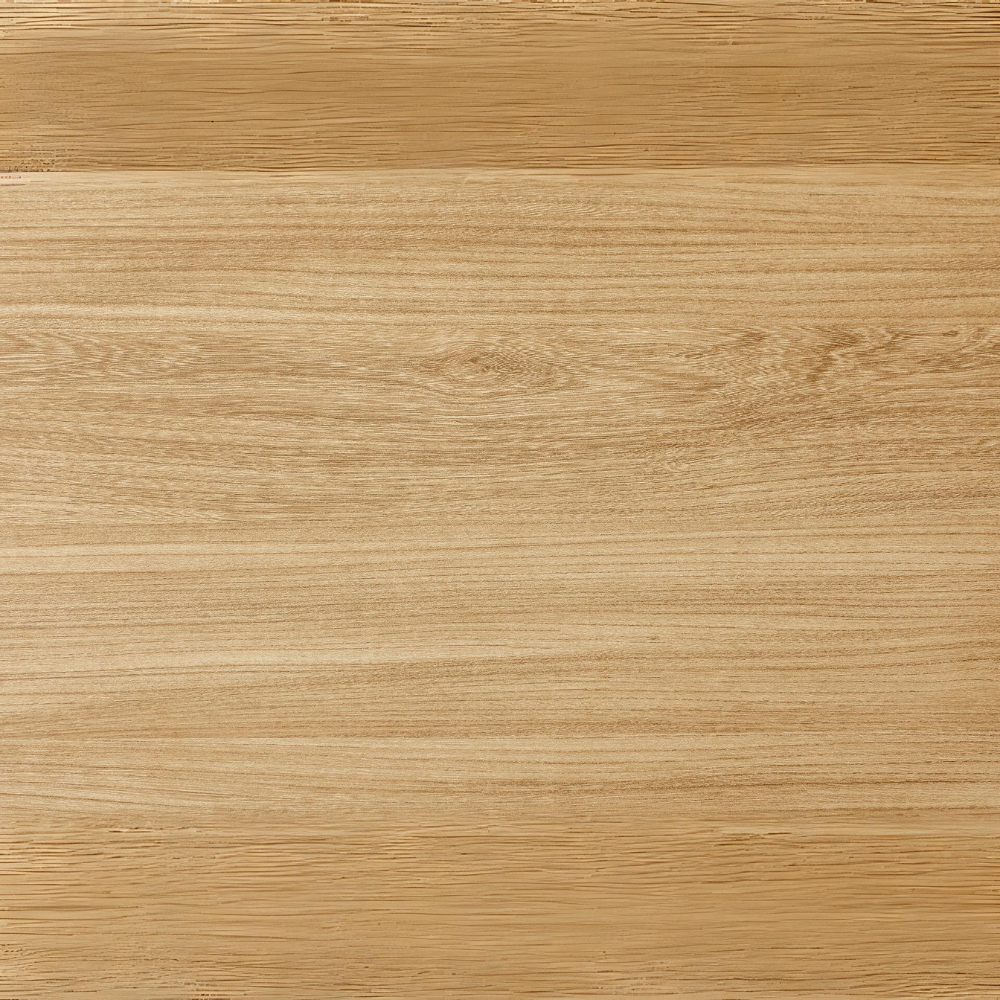 The Sadia Oval Dining Table in Oak features a durable, heat, stain, and scratch-resistant melamine top with a black metal base.