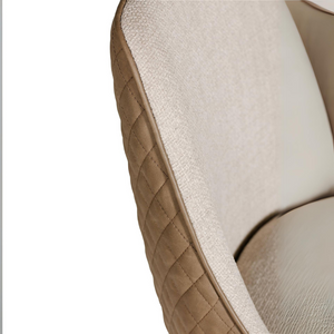 The Sadia Dining Chair in Biscuit features sleek black powder-coated metal legs for sturdy support and modern elegance.