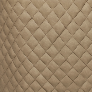 The Sadia Dining Chair in Biscuit features sleek black powder-coated metal legs for sturdy support and modern elegance.