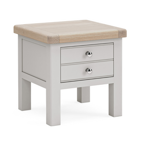 The Salcombe Lamp Table - Light Grey offers a durable oak veneer top, storage drawer, and lower shelf for a modern design.