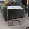 The Saloman Marble Top Accent Table features black and gold frame with a marble inspired top for a compact versatile piece, a timeless addition to any room