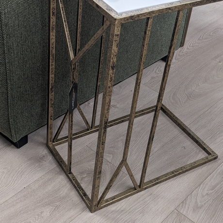The Saloman Marble Top Accent Table features black and gold frame with a marble inspired top for a compact versatile piece, a timeless addition to any room