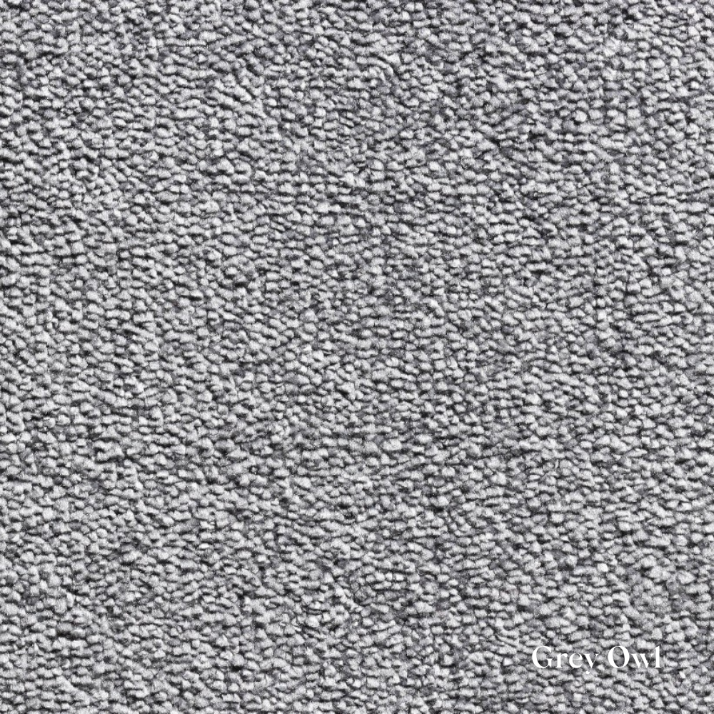 Close-up of textured gray carpet with 'Grey Owl' branding.
