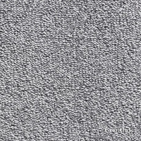 Close-up of textured gray carpet with 'Grey Owl' branding.