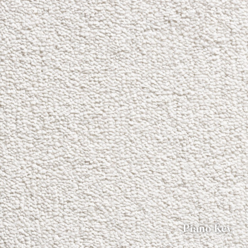 Close-up of a textured white fabric with 'Piano Key' label.