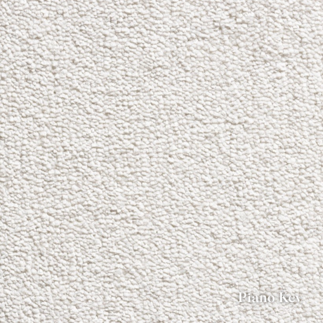 Close-up of a textured white fabric with 'Piano Key' label.