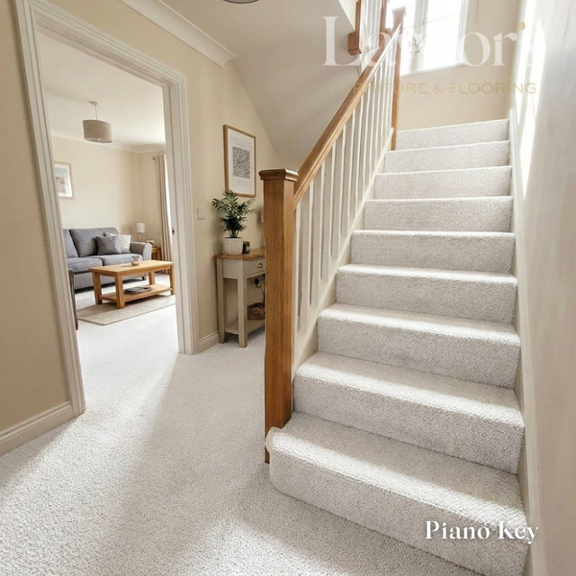 Staircase with carpeted steps leading to a living room