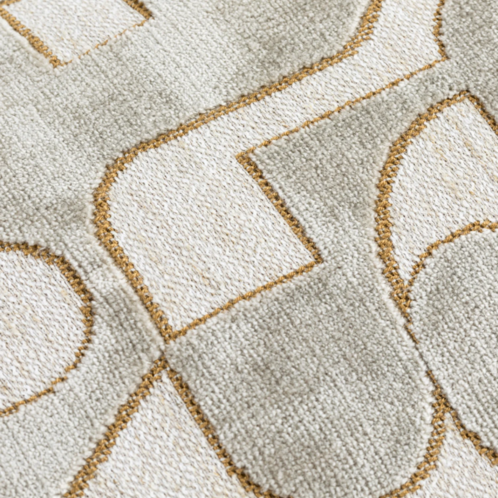 The Scatter Box Carter Natural Cushion 43x43cm features elegant gold detailing, a sleek knife-edge finish a neutral-toned palette & handcrafted in Ireland.