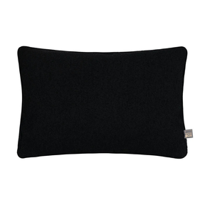 Handmade in Ireland, the Scatter Box Cora Cushion 35x50cm in black features a recycled boucle fabric, feather fill and elegant self piped edging