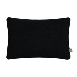 Handmade in Ireland, the Scatter Box Cora Cushion 35x50cm in black features a recycled boucle fabric, feather fill and elegant self piped edging