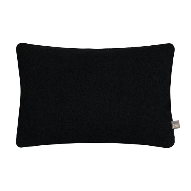 Handmade in Ireland, the Scatter Box Cora Cushion 35x50cm in black features a recycled boucle fabric, feather fill and elegant self piped edging