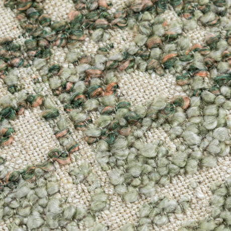 The Esme Scatter Box Green/Rose Cushion 43x43cm features a tactile fabric, subtle rose tones, a sleek knife-edge finish & handcrafted in Ireland.