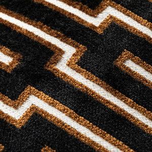 Scatter Box Cushion Harrison - 43x43cm, crafted in Ireland with premium fabric blend and feather filling. Bold black/cognac geometric design for modern luxury.