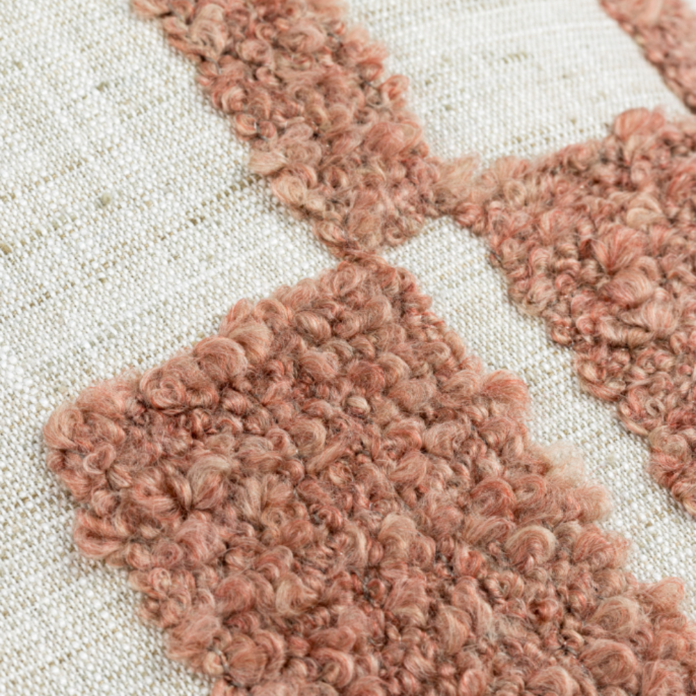 The Lila Scatter Box Rose Cushion 43x43cm features a linen-feel fabric, elegant pattern, a knife-edge finish and is handcrafted in Ireland.