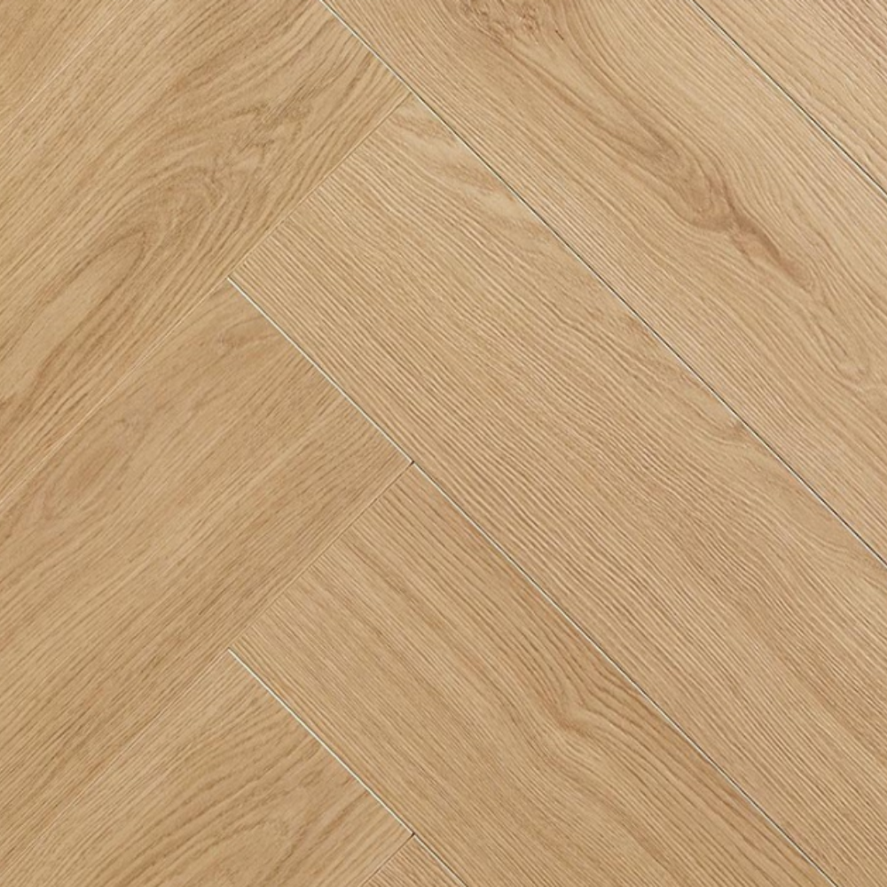 Light oak wood flooring planks arranged in a herringbone pattern, showing natural wood grain textures.