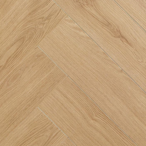 Light oak wood flooring planks arranged in a herringbone pattern, showing natural wood grain textures.