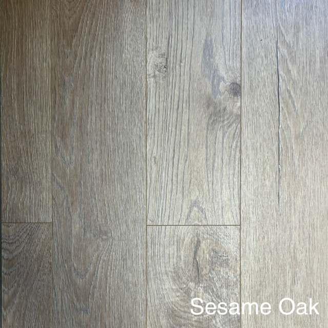 The Sesame Oak Laminate Flooring 12mm features dark oak finish, AC4 durability, underfloor heating compatible & 20-year warranty