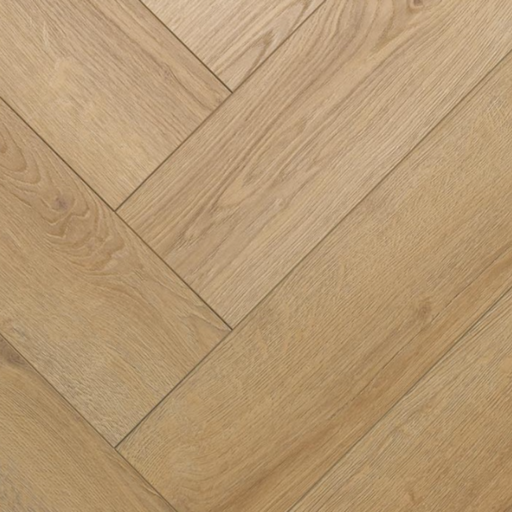 Light oak wood flooring planks arranged in a herringbone pattern, showing natural wood grain texture.
