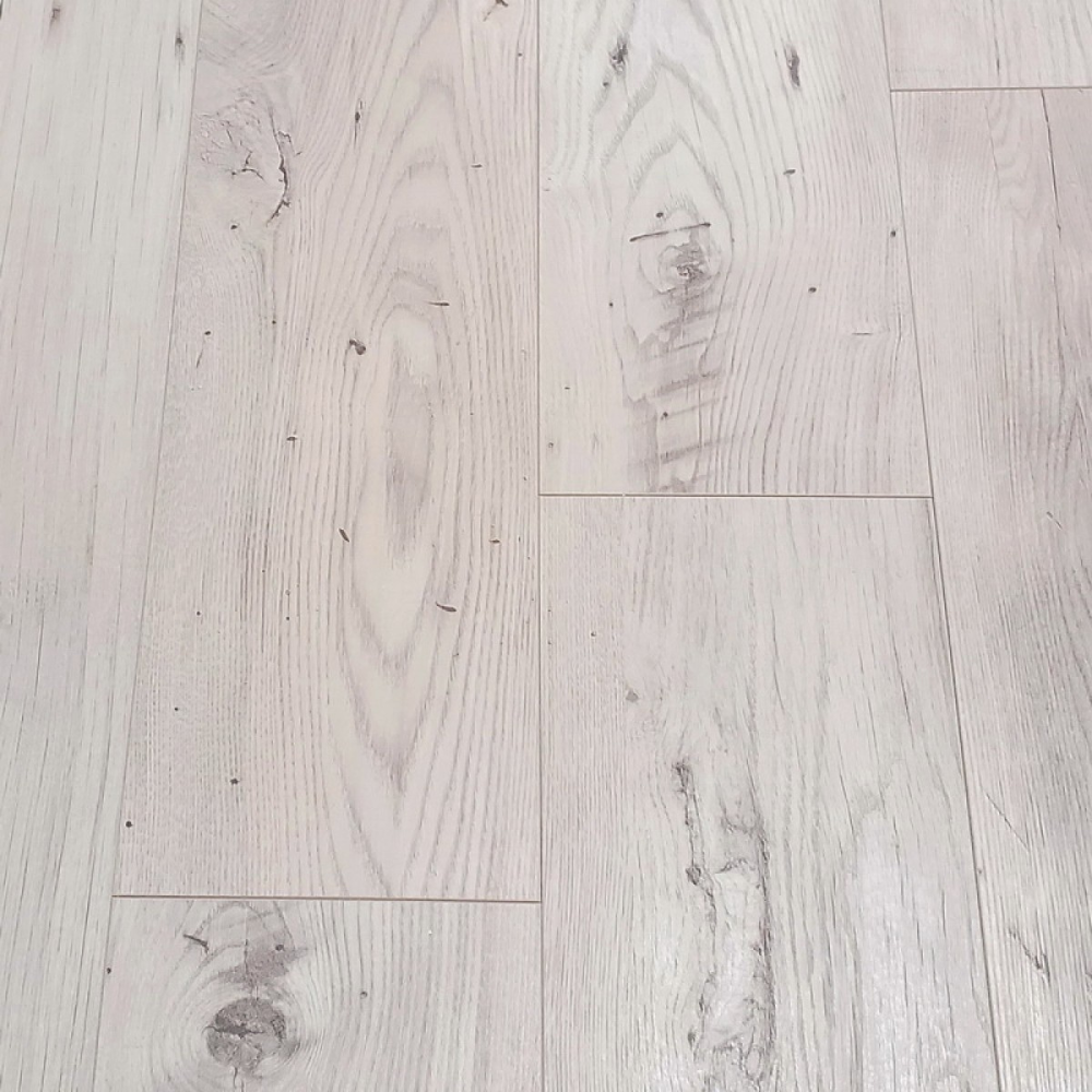 The Sound Chillout Oak Laminate Flooring - 12mm features AC5 durability, seamless installation, and a 30-year warranty included.