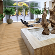The Sound Soul Oak Laminate Flooring - 12mm, AC5-rated, 3D texture, seamless installation, and underfloor heating compatible.