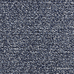 Textured blue surface with 'Tanzamite' branding