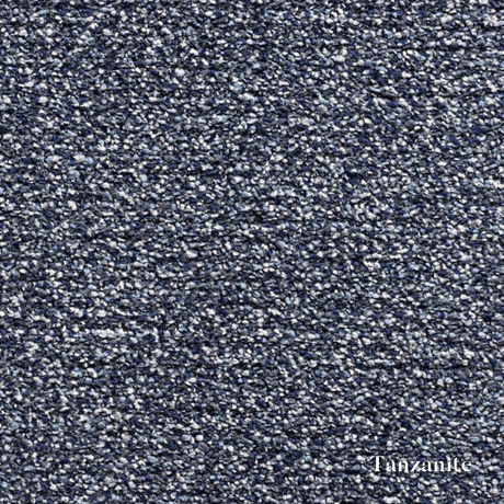 Textured blue surface with 'Tanzamite' branding