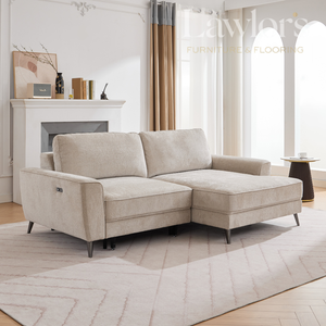 Beige LHF sectional sofa in a living room with a fireplace and large windows.