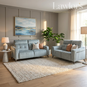 Living room with grey sofa set, a rug, and decorative items