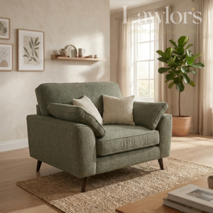 Green fabric sofa with cushions in a living room setting