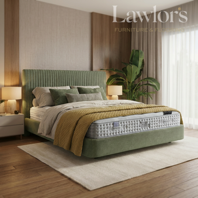 Bedroom with a green bed and mattress pack