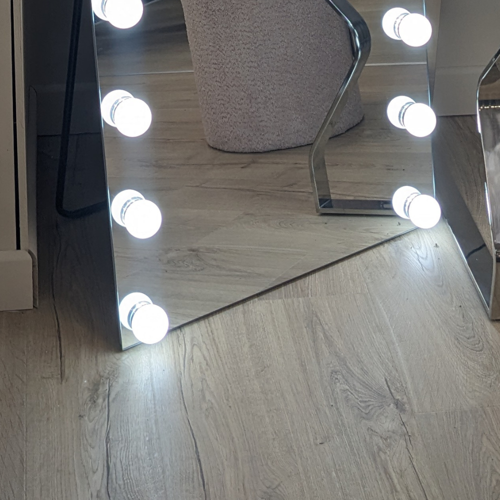 The Vanitti Hollywood 22 Bulb RGB Leaner Mirror features dimmable LEDs, smart touch controls, RGB colours and a detachable base for versatile glam lighting