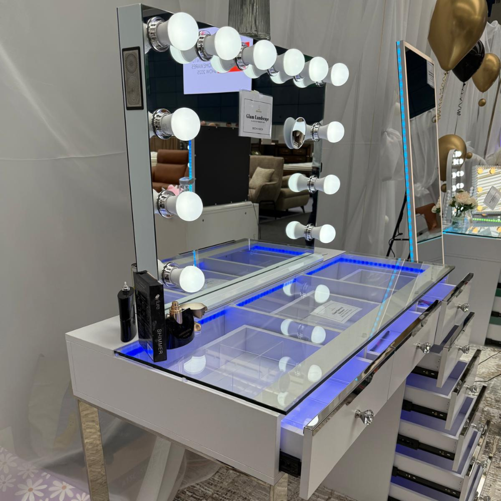 The Glamour Queen 8 Drawer Dress & 12 Bulb Hollywood Mirror Set features 8 spacious drawers, dimmable LED lighting, Bluetooth speaker & USB/Type-C ports