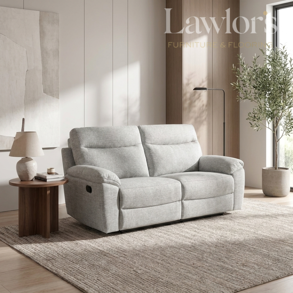 Light grey 2 seater recliner sofa in a living room setting