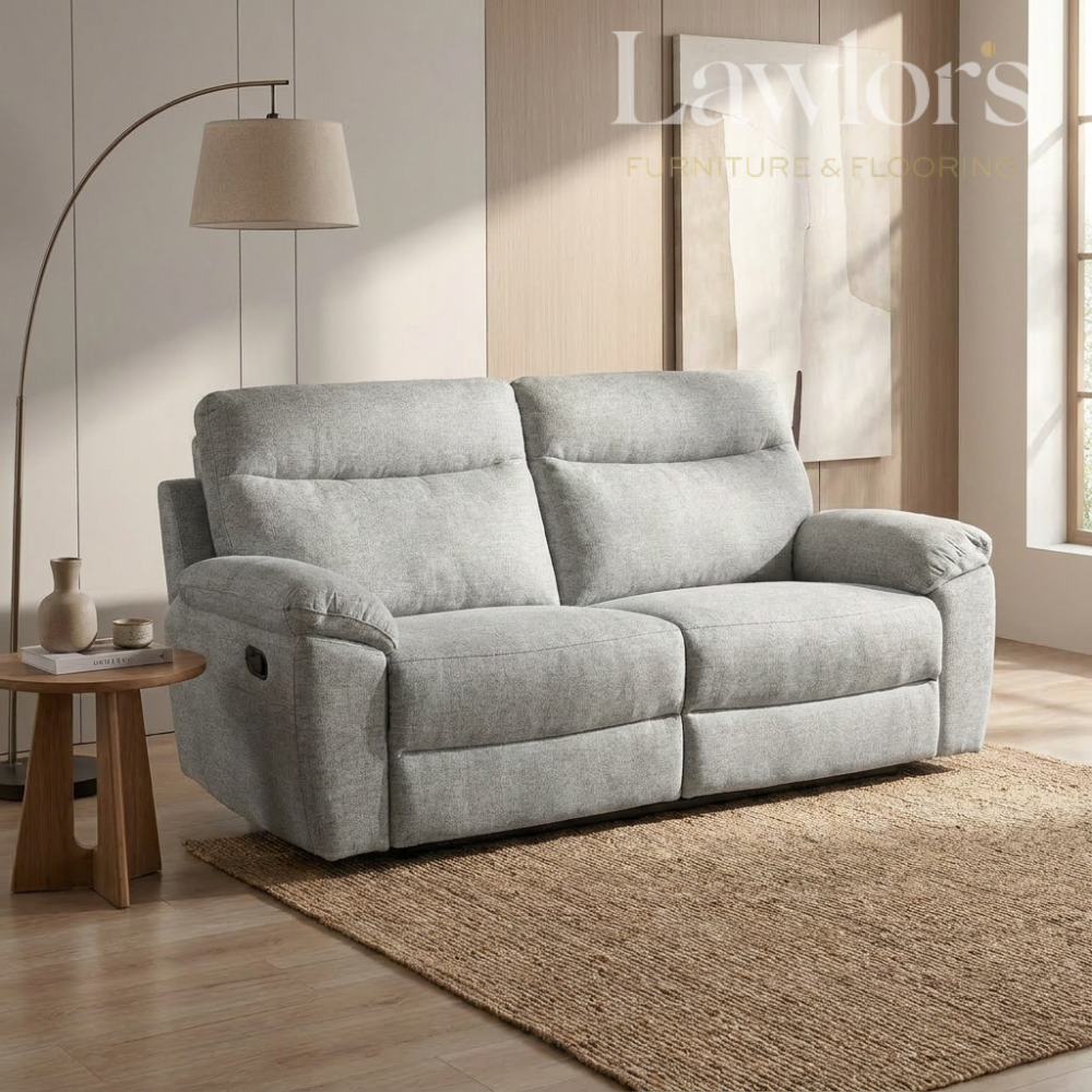 Light grey 3 seater recliner sofa in a living room