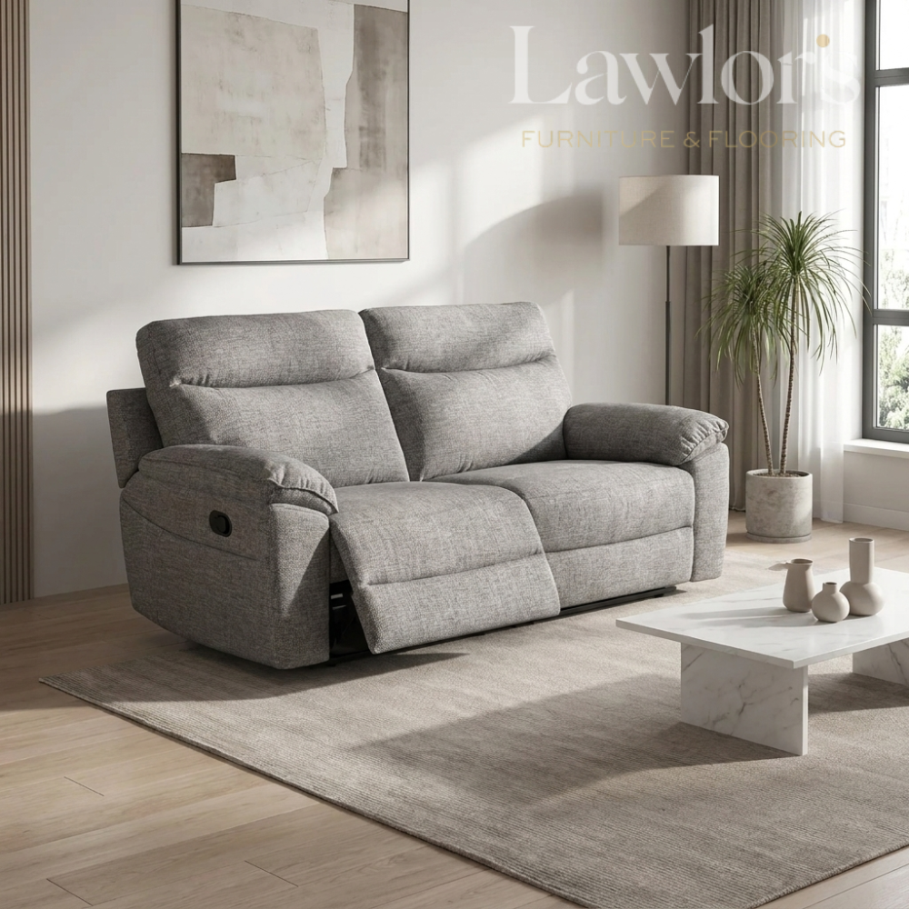 Dark brown 3 seater recliner sofa in a living room with a coffee table and decorative items