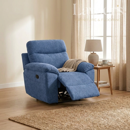 Light blue 1 seater recliner chair in a living room setting with a side table and lamp.