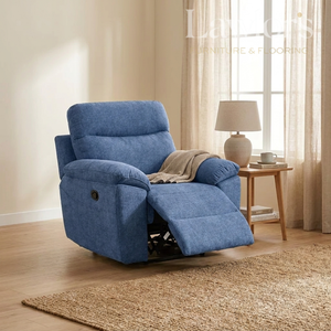 Light blue 1 seater recliner chair in a living room setting with a side table and lamp.