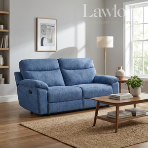 Light blue 3 seater recliner sofa in a living room with a coffee table and decorative items