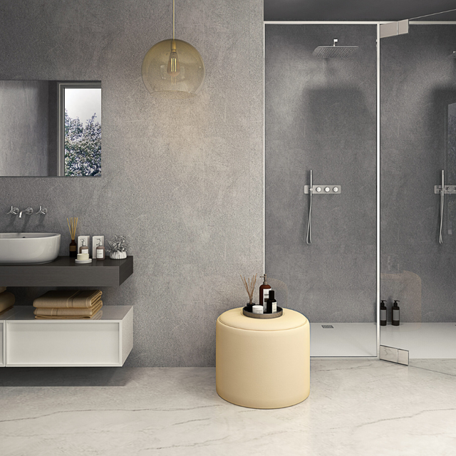 The Aquaply Elegance Cement wall panel features a modern grey cement effect with easy installation, antibacterial protection and a 35 year guarantee